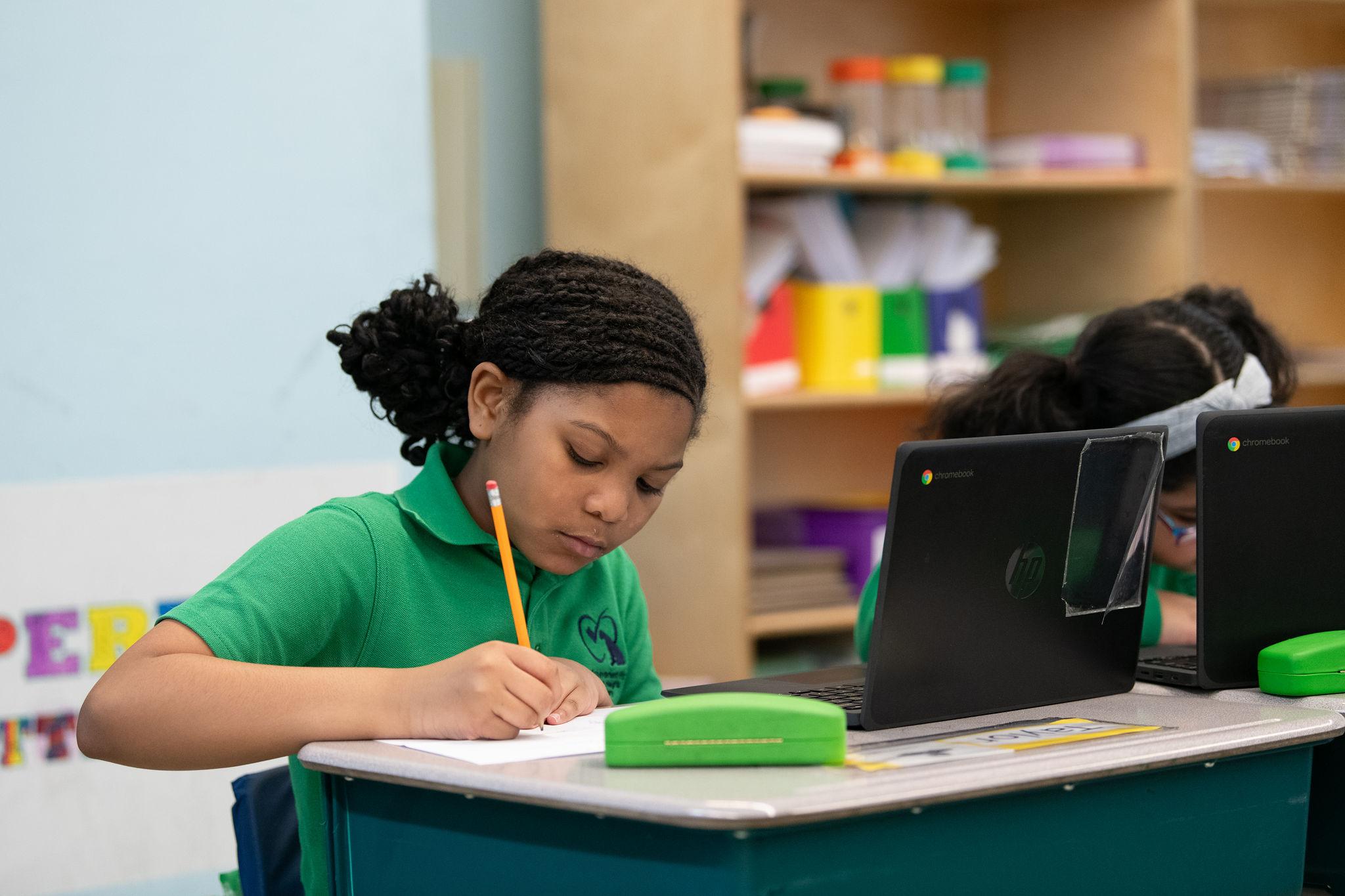 Teacher helping student