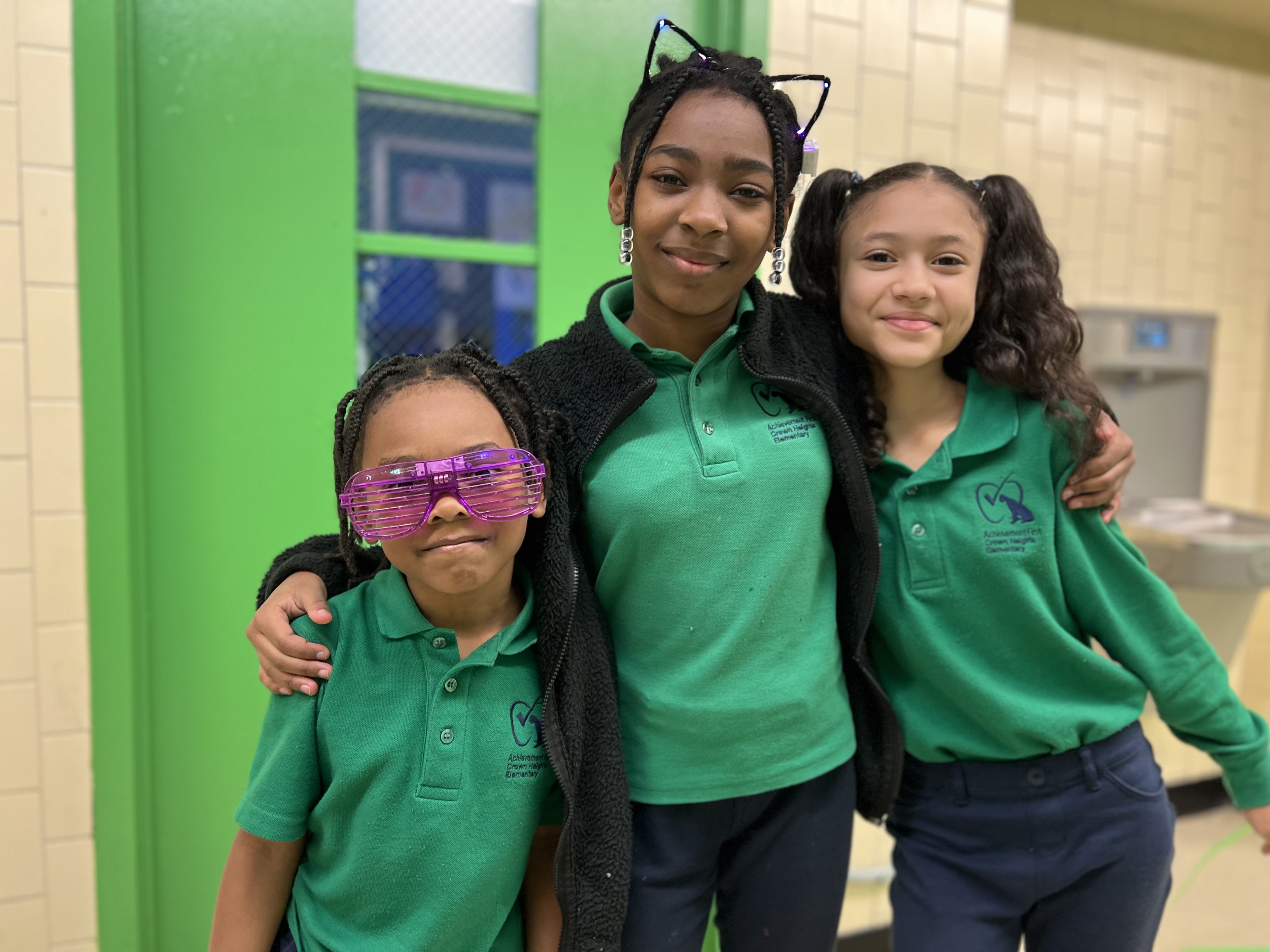 Group of students in green uniforms